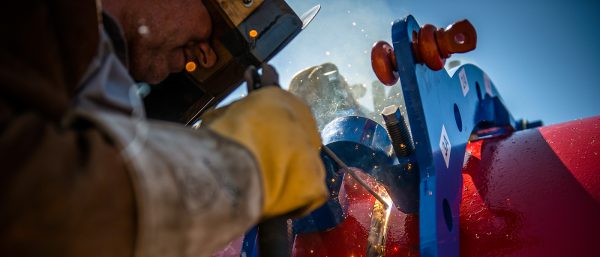 Welding with tie-in reforming clamp